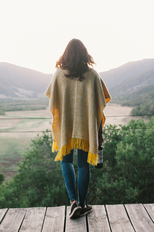Constanza Miranda poncho yellow product bottle artistic shots landscape VIK nature valley jeans tennis shoe ruana sneakers