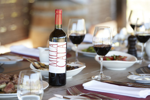 Gabriel Schkolnick Food Milla Cala Wine Glass Plate Pepper Water Bottle Wood Table Fork Knife Napkin Salad Pan Meat Product Bottle Shots red cutlery