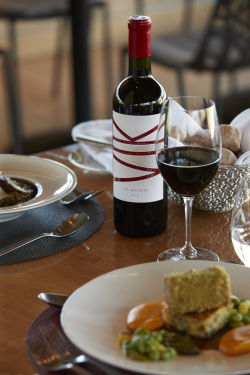 Gabriel Schkolnick table plate spoon fork red wine glass basket bread VIK bottle