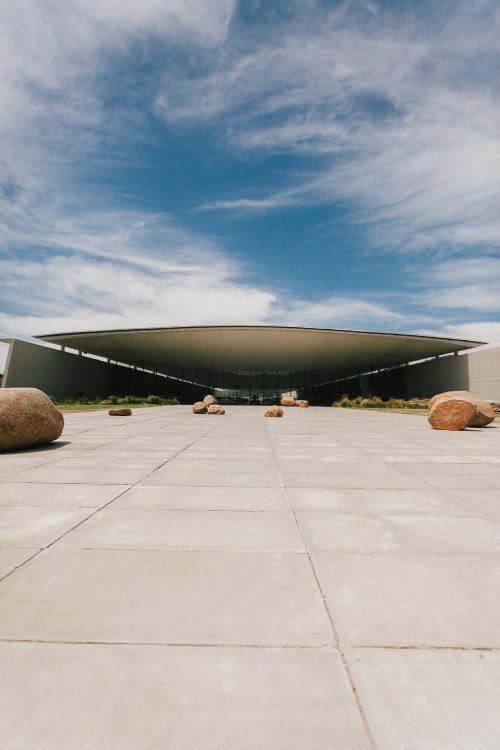 Exterior Constanza Miranda bush green plants rocks clouds sky architecture