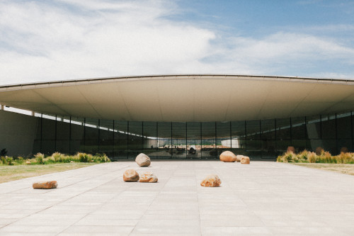 Exterior Constanza Miranda  rocks clouds sky bush green plants architecture