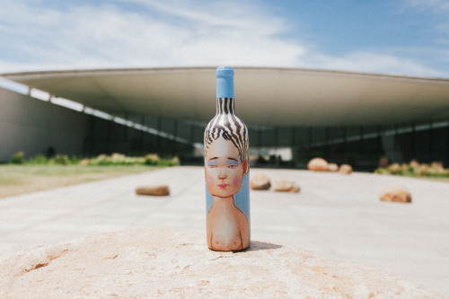 Constanza Miranda Bottle Artistic Shots La Piu Belle wine cellar blue sky rocks