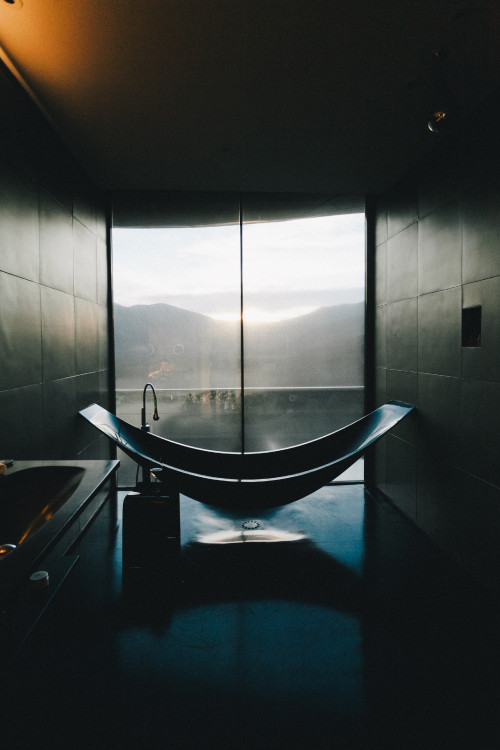 VIK Hotel Constanza Miranda bathroom interior bathtub  sink window view mountains glass wine