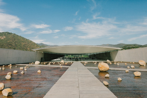 Exterior Constanza Miranda  water  rocks footpath  path  mountains landscape  clouds sky Sloping Plaza architecture