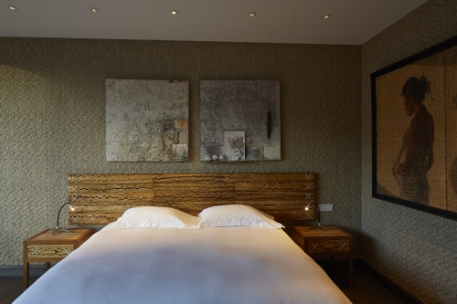 Chile Suite VIK Hotel interior rooms paintings double bed lamps tables