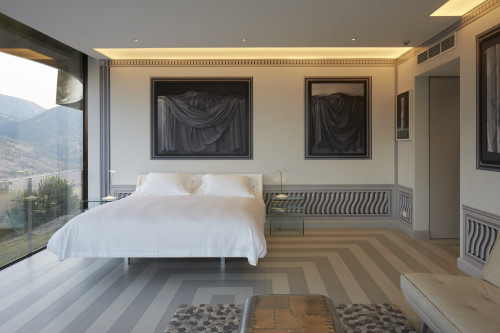 Interior VIK Hotel Rooms  window view double bed table sofa lamp Gabler's Grisaille paintings landscape mountains Guest Suite Chile