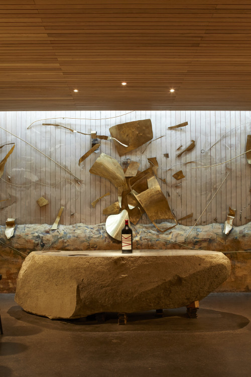 interior tasting rooms  wood VIK sculpture bottle artistic shots stone table
