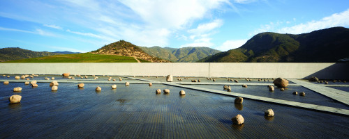 Exterior Cristóbal Palma  Sloping Plaza mountains rocks landscape blue sky clouds green footpath water path architecture