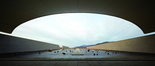 Exterior Cristóbal Palma  Sloping Plaza mountains rocks  blue sky clouds  footpath water path architecture