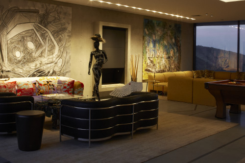 Living Room sofas mannequin hat woman cushions paintings sculpture view window mountains pool table carpet chair interior VIK hotel billiard