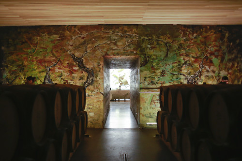 interior barrel tasting room VIK bottle light sculpture wood architecture
