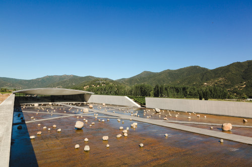 Exterior sloping plaza rocks  footpath water mountains blue sky landscape nature crops vine architecture
