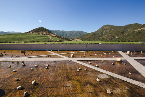Exterior sloping plaza rocks footpath water mountains valley blue sky crops vine landscape nature architecture
