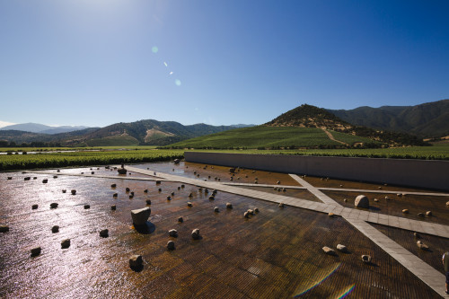 Exterior sloping plaza rocks  footpath water mountains valley blue sky crops vine landscape nature architecture