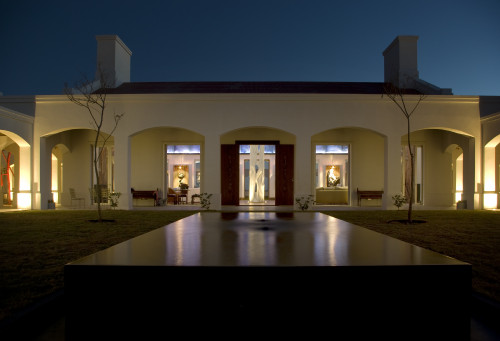 North Garden Living Room Estancia VIK Jose Ignacio Uruguay night view sculpture paintings sofas chairs trees patio statue