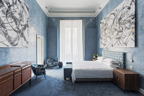 Galleria VIK Milano Italy Palace Rooms Suites 209 Vicky B furniture bedroom 
double bed door  headboard lamps books pillows curtains sofa flowers paintings armchair bench
