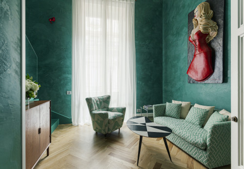 Galleria VIK Milano Italy Suites Gallery Suites 220  Cassará sofa armchair curtains sculpture furniture table cushions flowers book door steps