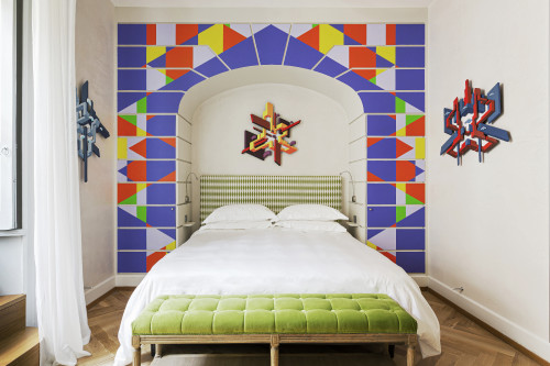 Galleria VIK Milano Italy Suites Deluxe Gallery Rooms  320 Rendo light
bedroom double bed door  headboard lamps books pillows curtains sculpture bench