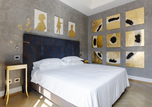 Galleria VIK Milano Italy Suites Deluxe Rooms 401 Trailina bedroom double bed headboard pillows  paintings furniture night table lamp