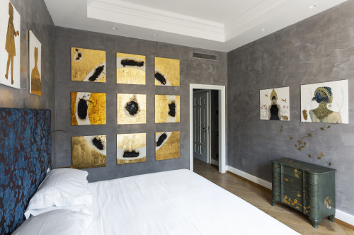 Galleria VIK Milano Italy Suites Deluxe Rooms 401 Trailina bedroom double bed headboard pillows door paintings furniture Chest of drawers lamp