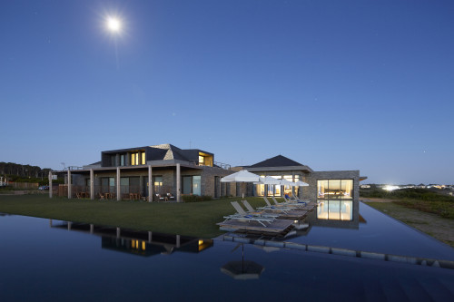 Bahía VIK José Ignacio Uruguay pool swimming Main Building Lounging chairs sunshade sunset lights terrace exterior