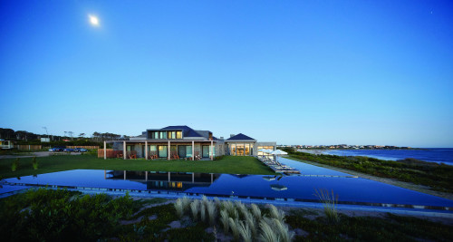 Bahía VIK José Ignacio Uruguay pool swimming Main Building Lounging chairs sunshade sunset lights terrace exterior plants sea blue sky village bush