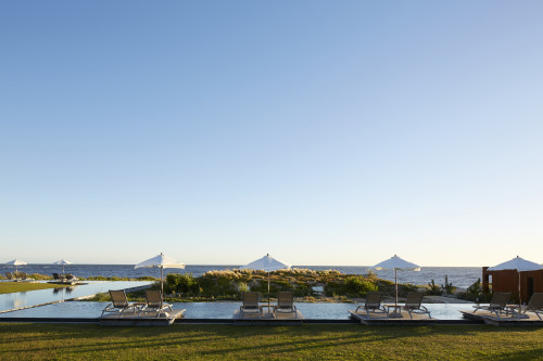 Bahía VIK José Ignacio Uruguay Main Building swimming pool Lounging chairs landscape exterior sunshade grass bush sea