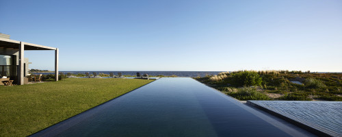 Bahía VIK José Ignacio Uruguay pool Main Building bush grass water sea blue sky