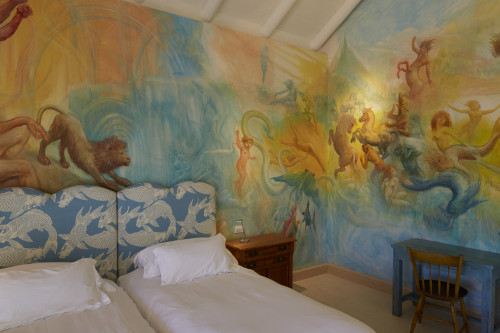 bedroom double bed headboard pillows night table lamps Gil Suite Chapa Azul Bungalow Bahía VIK José Ignacio desk chair wall paintings lights