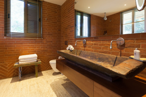 Bahía VIK José Ignacio Bungalows Quincha Piquete bathroom sink mirror 
stool wood shower blind window towels