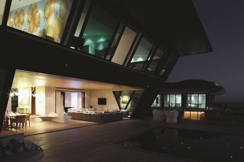 Playa VIK José Ignacio Uruguay building lights  architecture exterior Sculpture  terrace swimming pool lights evening view setting table sofas armchair lights