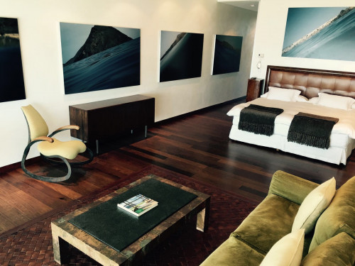 Playa VIK José Ignacio Uruguay Guest Suite FuerteVentura  Bedroom double bed headboard pillows night table  interior  blanket door sofa cushion carpet books furniture paintings rocking chair