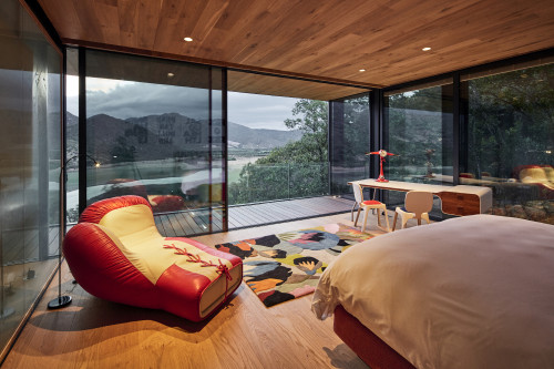 Puro VIK Chile Casas Letras bedroom double bed lamp carpet chair desk window view mountains valley lake landscape nature lights interior
boxing glove armchair