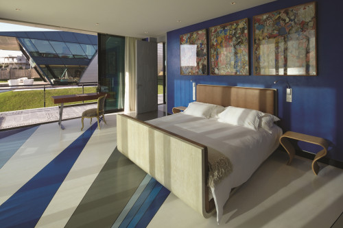 Playa VIK José Ignacio Uruguay  Casas Casa Mar Master Bedroom double bed headboard pillows night table lamps  chair desk sculpture interior grass window view terrace blanket door