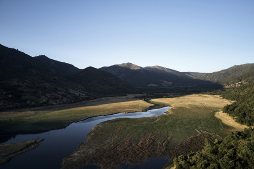 Puro VIK Chile exterior landscape nature mountains trees green lake reservoir valley
