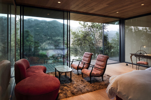 Puro VIK Chile Shape of Woman bedroom  lamp carpet window red desk chair sofa table window view mountains valley light  balcony trees nature armchair