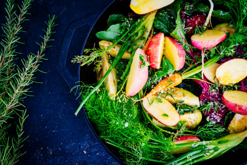 skillet  vegetables potato carrots beet onion rosemary food