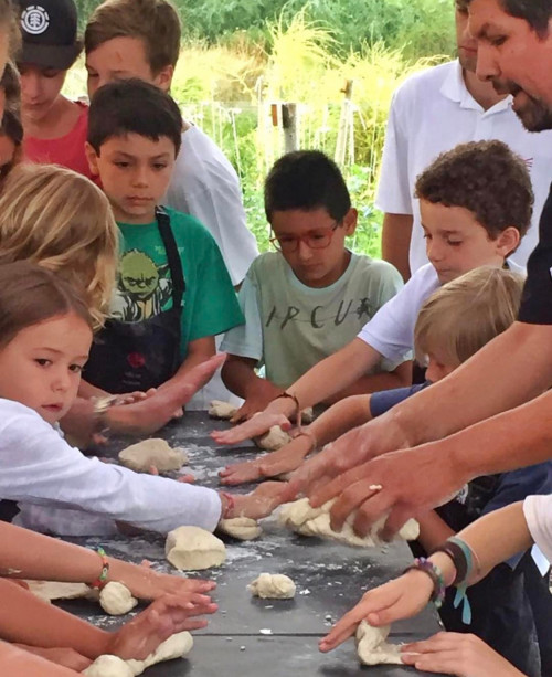 children boys girls table dough hands
