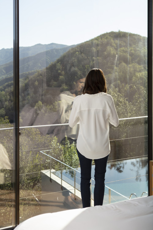 VIK Hotel Juan Pablo Jaramillo  landscape window view valley mountains bed double  carpet lake reservoir swimming pool interior ladder woman Chile