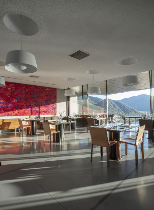 VIK Hotel Milla Milla Restaurant dining table  set window view   Juan Pablo Jaramillo mountains nature interior chair lamp glass Chile