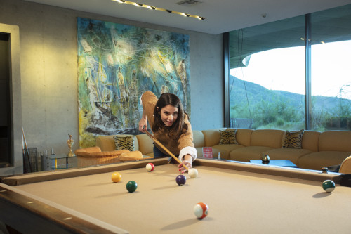 VIK Hotel sofas  table  pool billiard  window view woman cushion paintings mountains Juan Pablo Jaramillo Chile