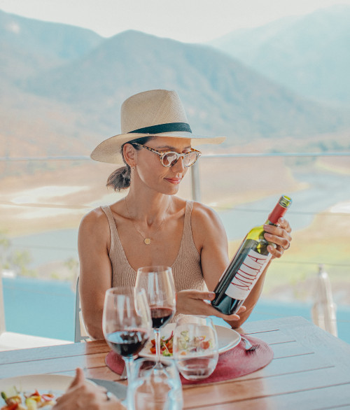 Carmen Cabezas Leonor Varela 2022 Hotel Chile wine red Milla bottle terrace food table