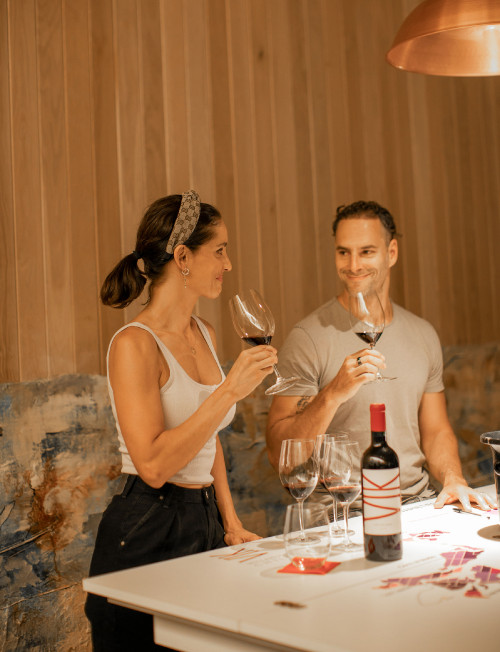 Carmen Cabezas Leonor Varela 2022 Hotel Chile wine drinking couple table bottle glass