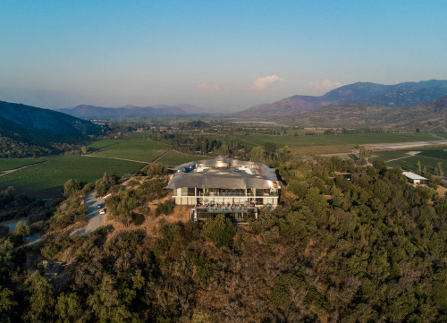 Carmen Cabezas 2022 Hotel Chile view from above landscape pool roof field courtyard trees mountains blue sky