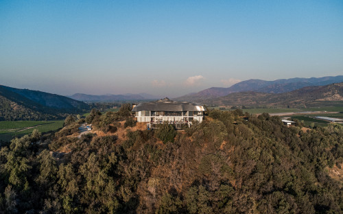 Carmen Cabezas 2022 Hotel Chile landscape pool roof field trees mountains blue sky hill